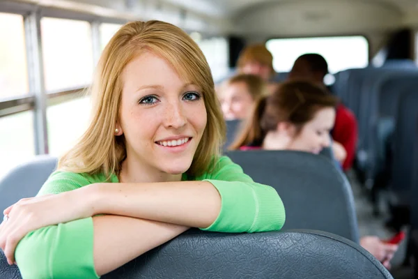 School Bus: Female Student Leaning On Seat