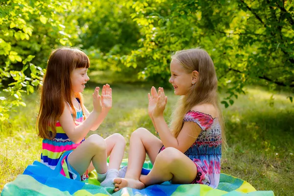 Childrens playing clapping game