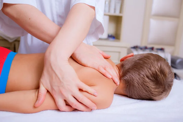 Boy getting back massage