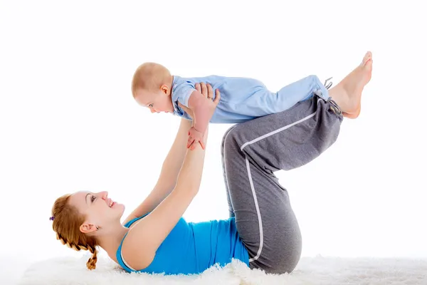 Mother with a child engaged in yoga