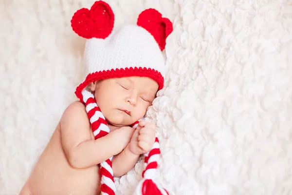 Cute baby girl in red hat