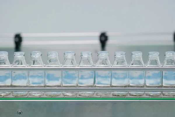 Glass bottles on the conveyor belt