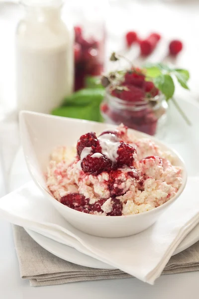 Dieting cottage cheese with fresh raspberry