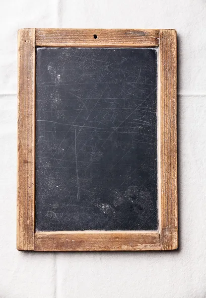 Vintage slate chalk board on textured background