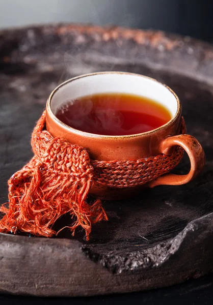 Cup of hot tea in scarf