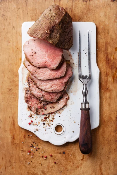 Roast beef and fork
