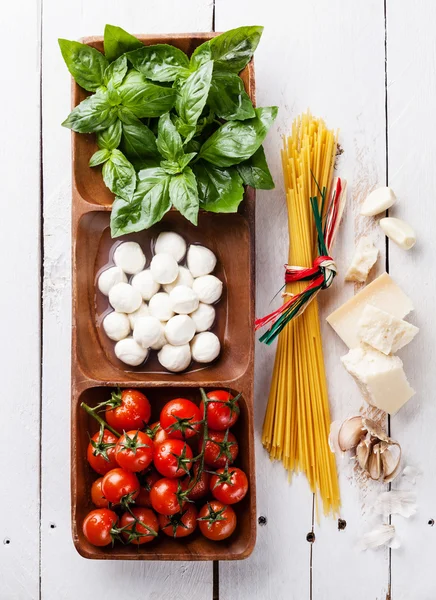 Italian flag colors with Green basil, white mozzarella, red toma