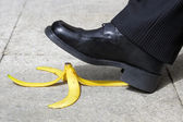 Falling on a banana skin Stock Photo