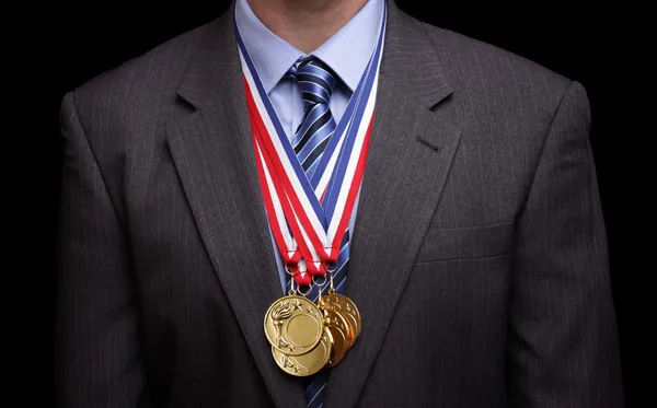 Succesful businessman with gold medals