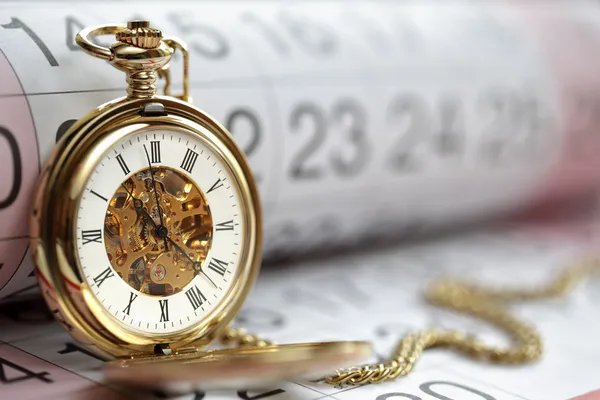 Gold pocket watch and calendar