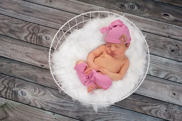 Sleeping Newborn Baby Girl Wearing Pink Sleeping Cap