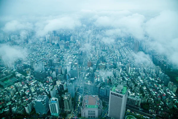 King of the clouds overlooking Taipei 101 Tower in Taipei, Taiwan