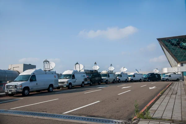 Taiwan Taoyuan International Airport Terminal next to a row of parked cars on TV