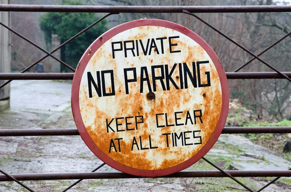 Rusty no parking sign