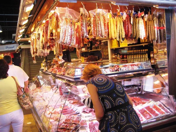 Mercat de la Boqueria - Boqueria market in Barcelona, Spain. Food, vegetables, fruits, peppers, tomatoes, sausage, meat, drinks, chili