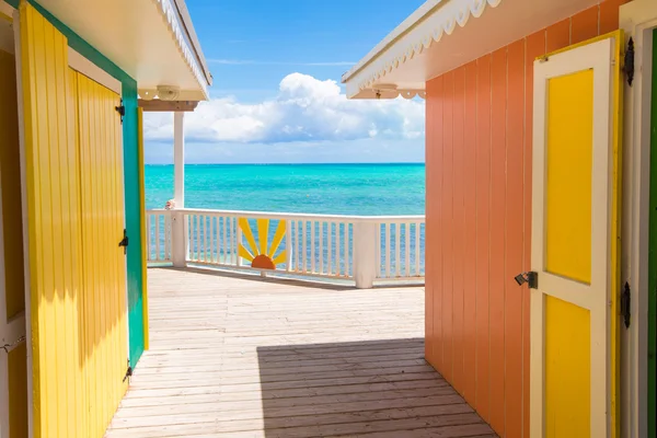 Traditional bright Caribbean houses on shore