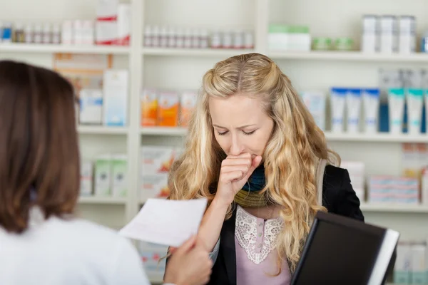 Customer Coughing In Front Of Pharmacist