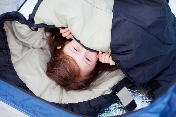 Portrait Of Little Girl Lying In Sleeping Bag