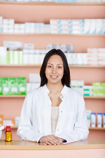 Young employee at pharmacies counter