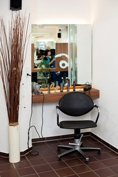 Salon With Chair, Counter And Reflection On Mirror