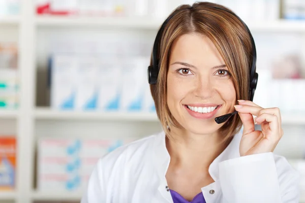 Chemist woman with headset