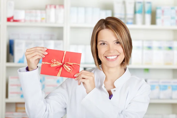 Pharmacist with card