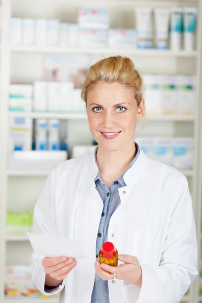 Blond Female Pharmacist With Prescription