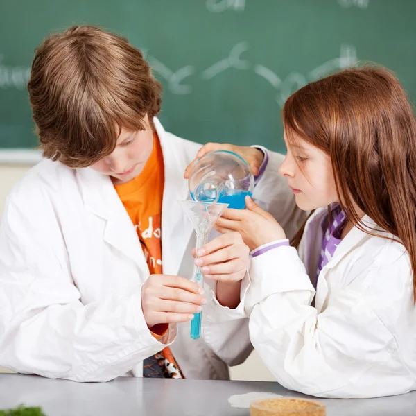 Young students learning chemistry