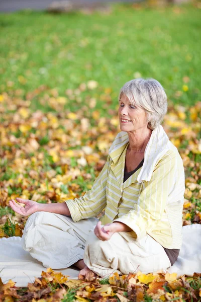 Woman Meditating In Lotus Position