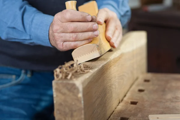 Carpenter making something out of wood