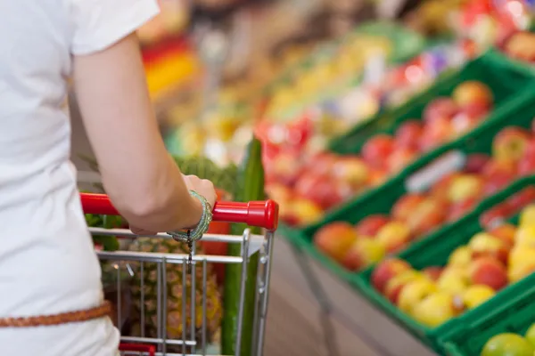 Cropped Image Of Woman Pushing Shopping Cart In Store