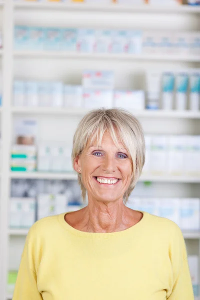 Smiling active senior in the pharmacy