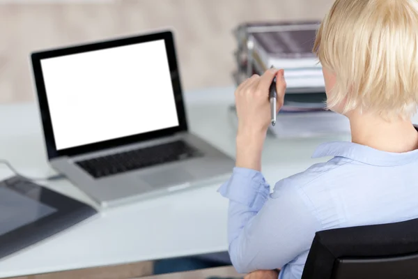 Creative Office Worker Looking At Laptop