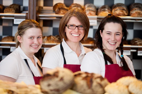 Three happy bakery workers