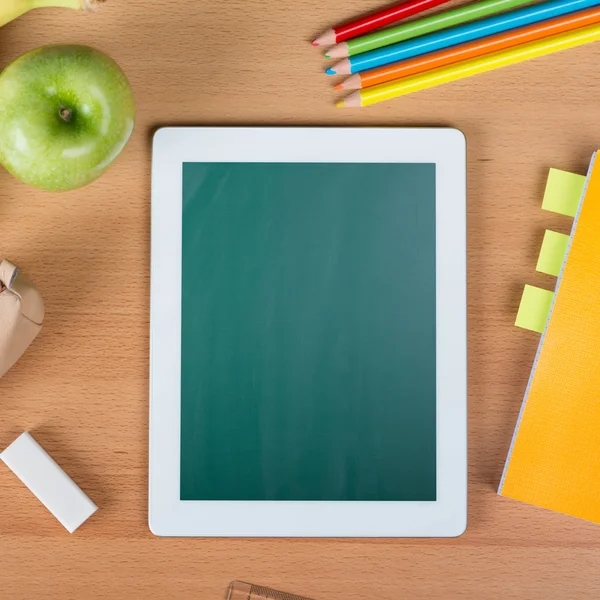 Digital tablet over a school desk