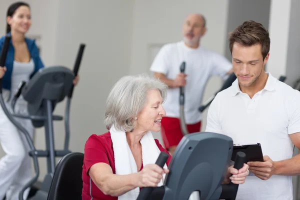Senior woman with a personal fitness trainer