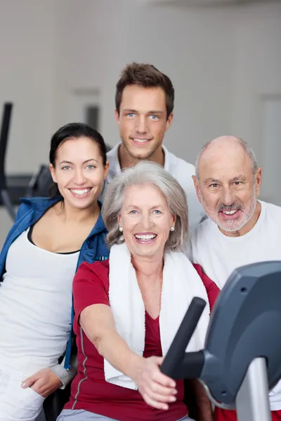 Family Smiling Together In Gym