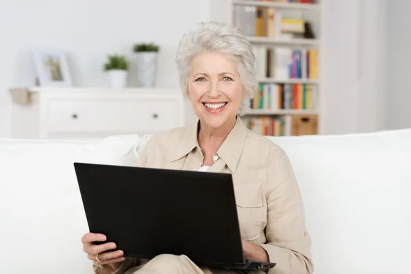 Senior woman working an a laptop
