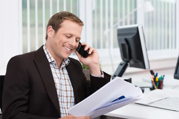 Efficient businessman answering a phone call