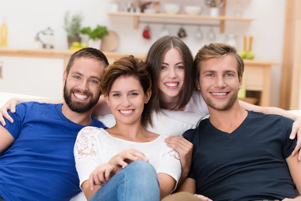 Group of happy young men and women