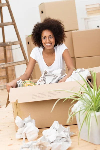 Beautiful woman packing to move house
