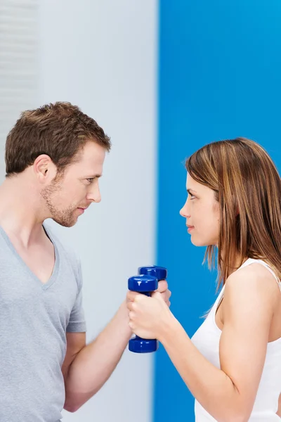 Couple working out at the gym