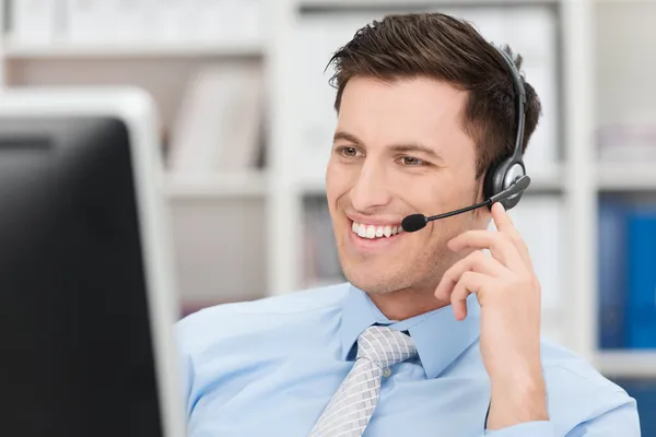 Smiling friendly male call centre operator