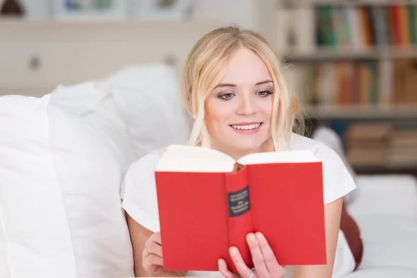 Beautiful woman relaxing with a good book