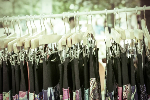 Clothes on a rack on a flea market