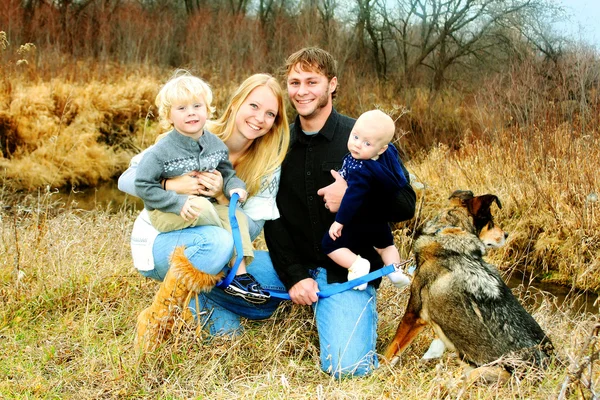 Happy Family by River in Late Autum