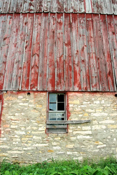 Exterior Wall with Broken Window on Old Barn