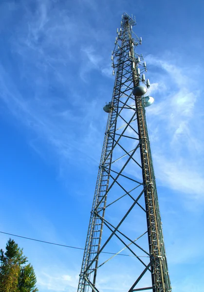 Cell Tower Against Cloudy Sky