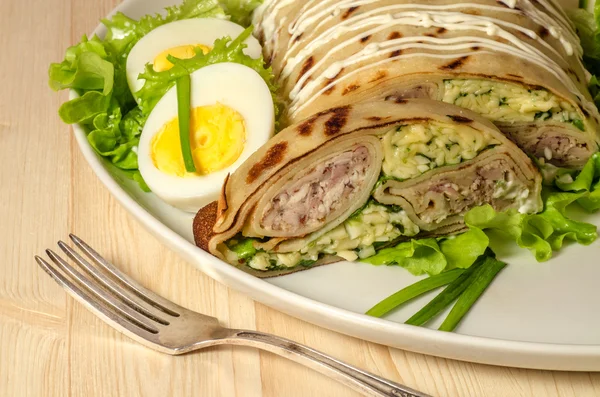 Terrine with chicken, cheese and pancakes