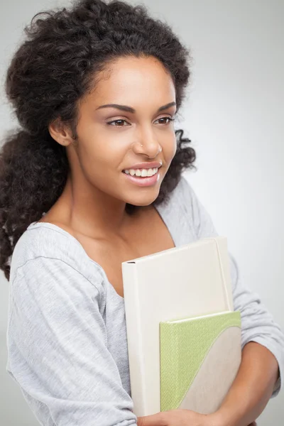 Smiling College Student Holding Notebooks